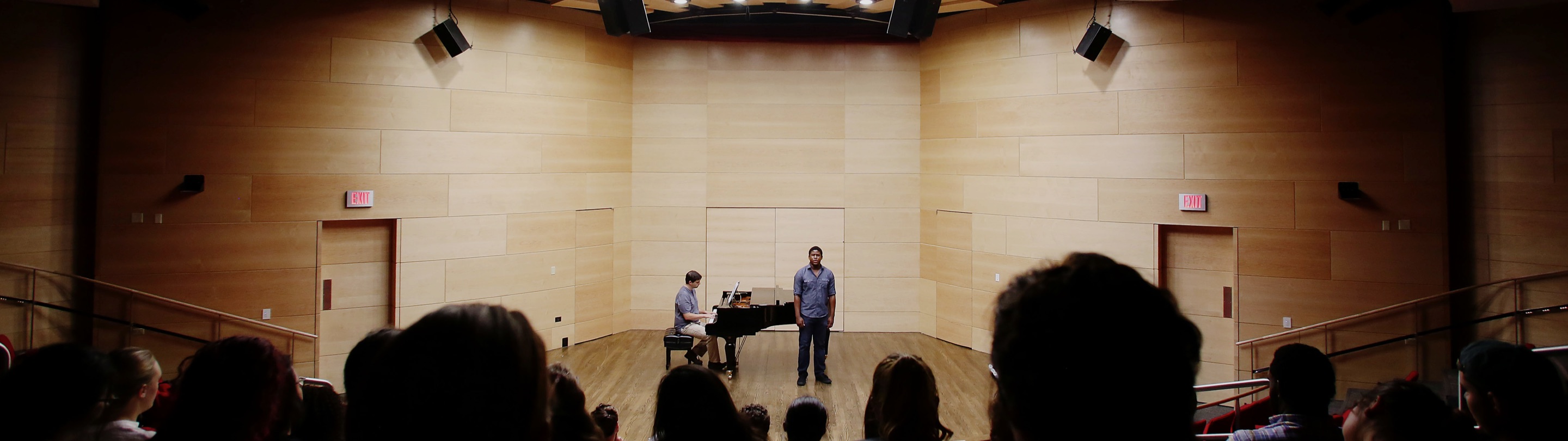 Pianist and vocalist on stage performing