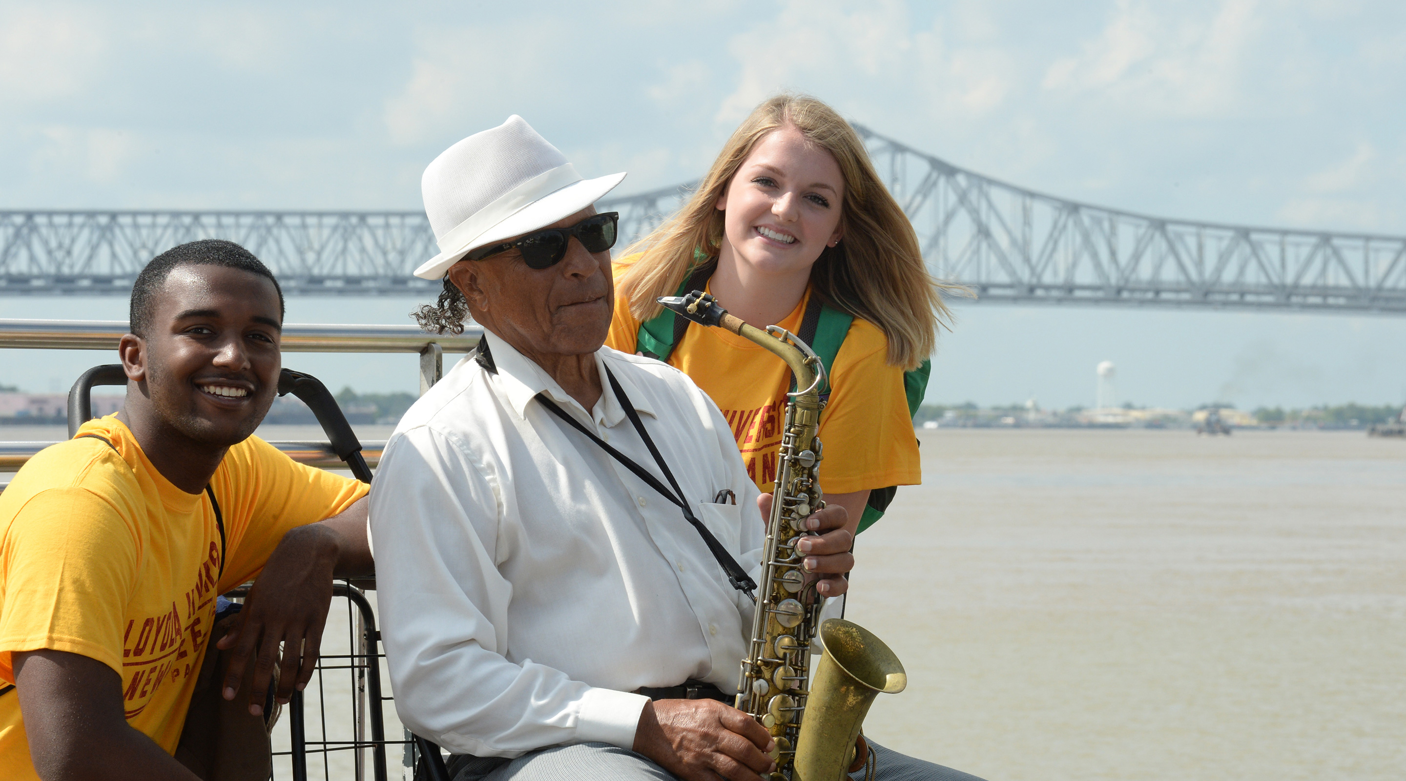 Students with Jazz player on river