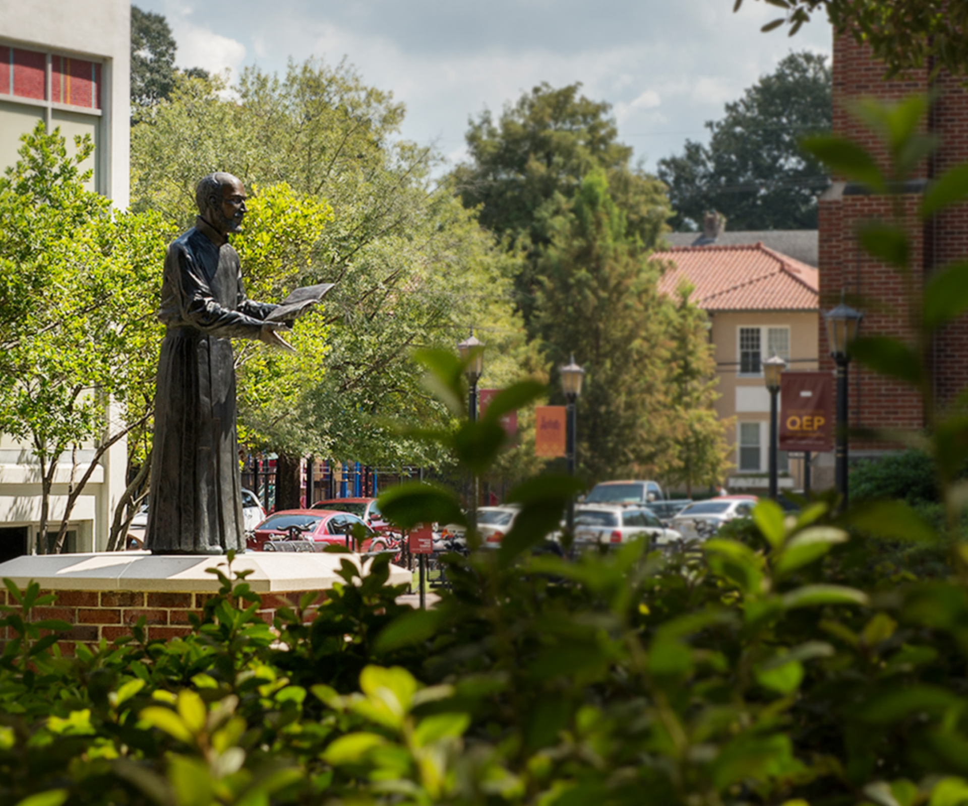 Statue of Ignatius viewed from the side on campus