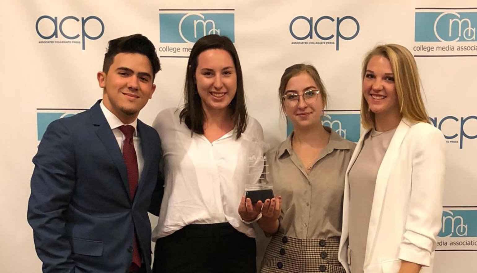 Four students with award