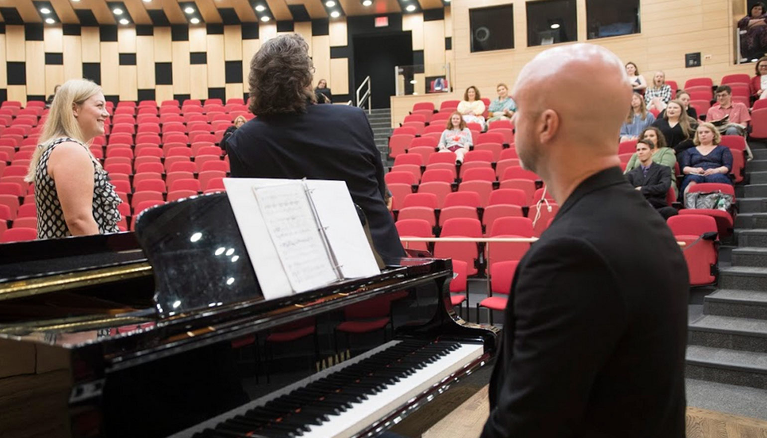 Students learning from opera singer