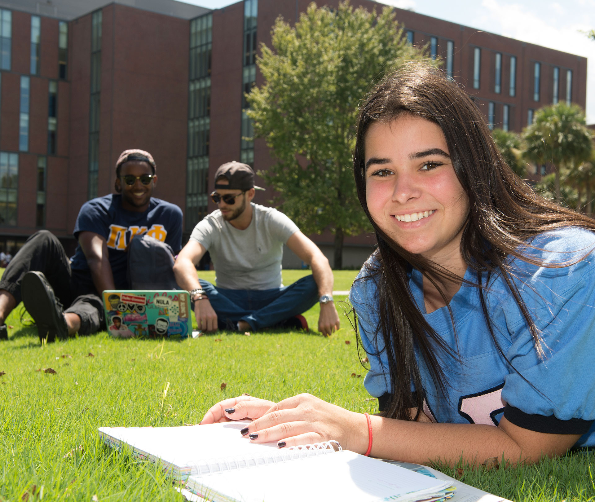 Student studying on Loyola's quad in New Orleans