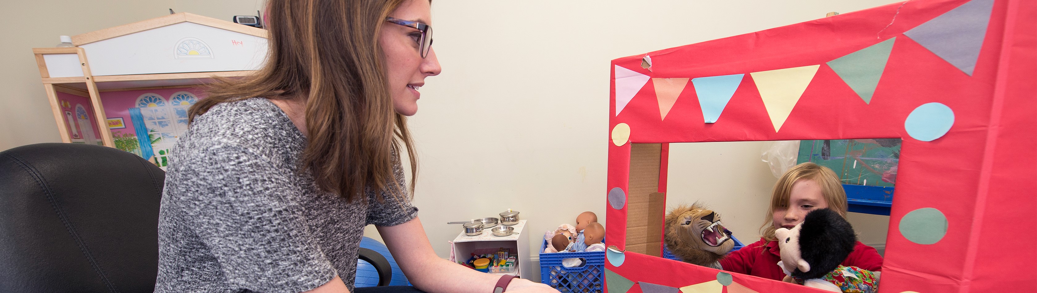 Online psychology student working with a child patient.