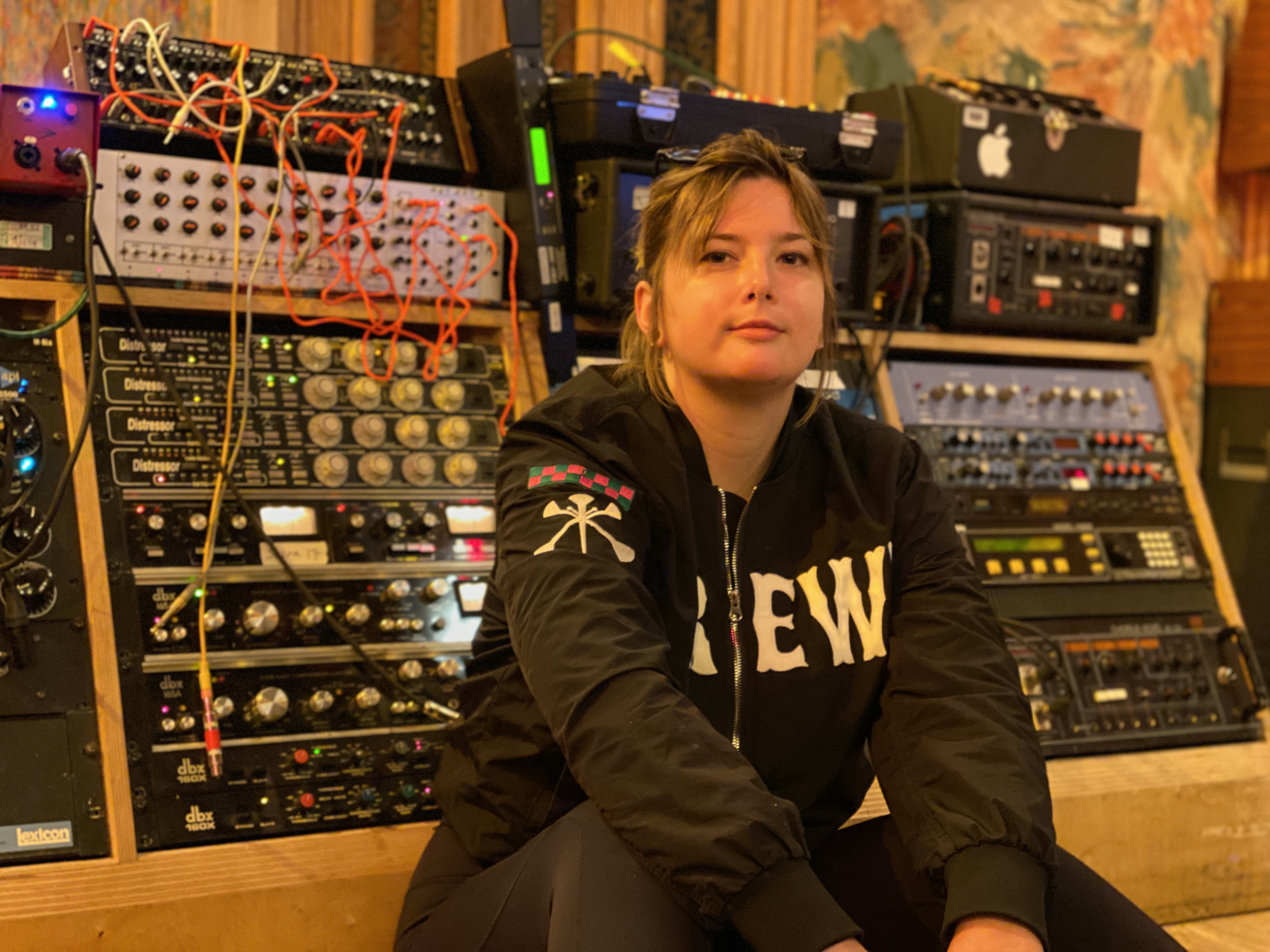 woman, sound equipment, dark hoodie