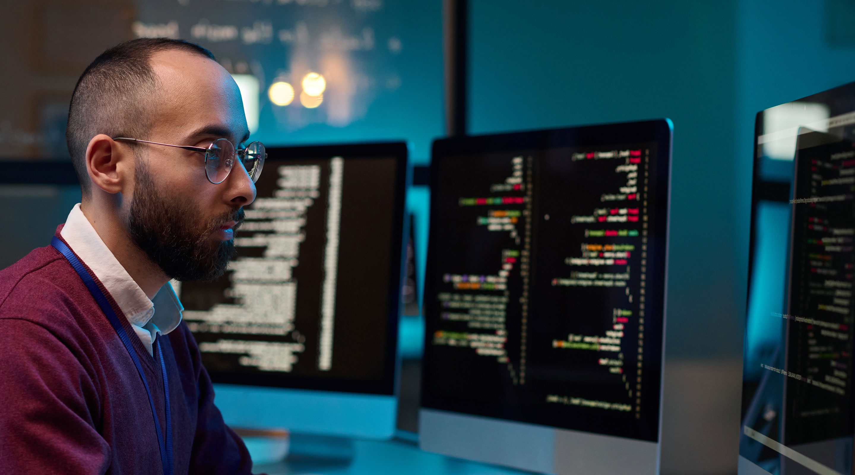 Loyola college student studies on computer at work